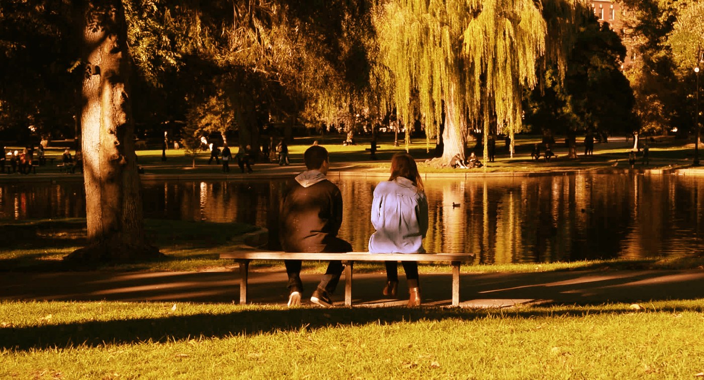 Jaryd Massaro and his sister Marisa seated on a bench in the Boston Public Garden