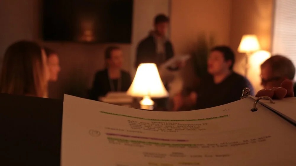 Jaryd Massaro reviewing a script during a production meeting